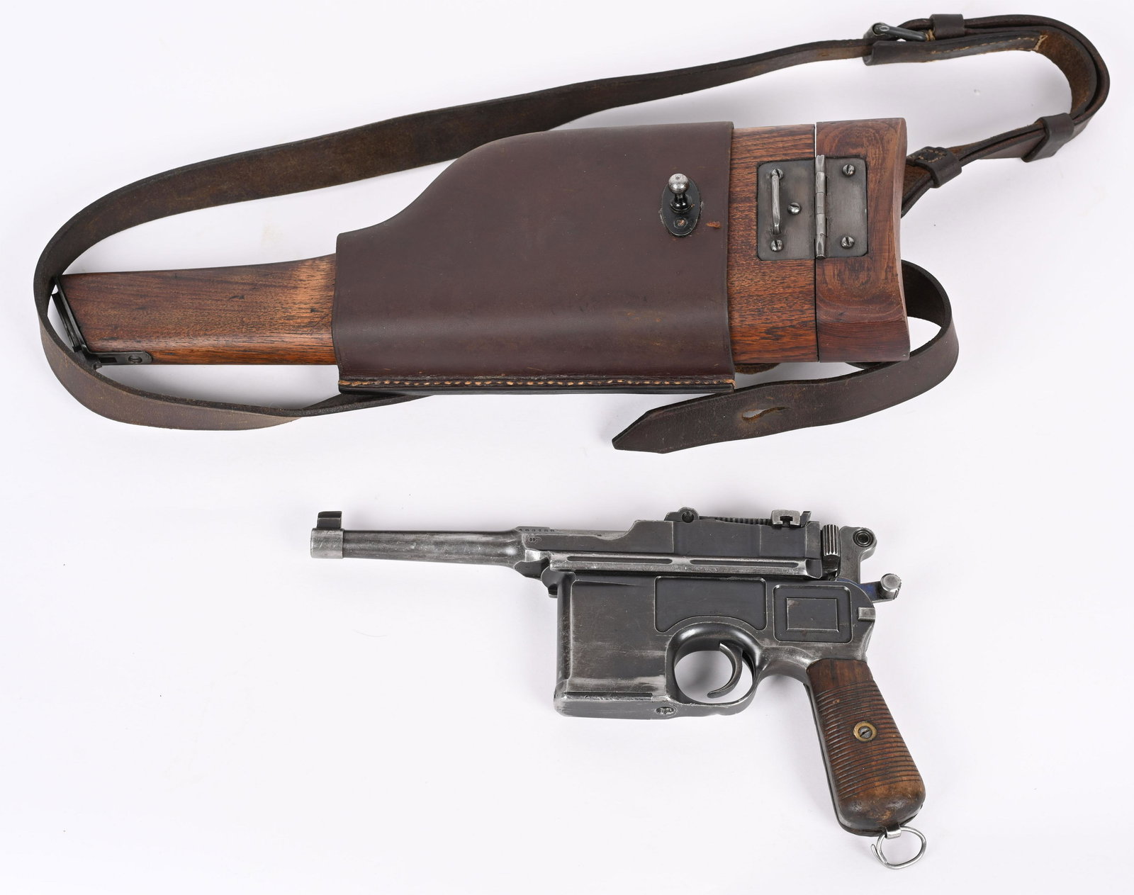 MAUSER C96 BOLO BROOMHANDLE PISTOL: SERIAL NUMBER 463153 BARREL 4" CALIBER 7.63 MAUSER MANUFACTURED 1921-23. Rust blue finish with grooved 2 piece wood grips and nitre finished small parts. Slotted for shoulder stock. Matching numbers w