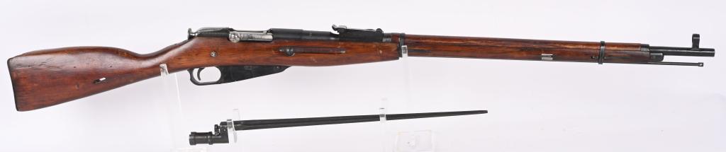 RUSSIAN IZHEVSK M91/30 MOSIN NAGANT WITH BAYONET: SERIAL: RMN024490. BARREL: 19". CALIBER: 7.62x54R. MANUFACTURED: 1942. Standard Soviet markings on the chamber. Import marked on the receiver. Matching serial numbers on the barrel shank, bolt trigger