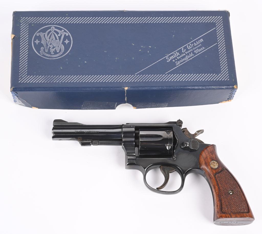 S&W MODEL 15-4 .38 REVOLVER.: SERIAL 86K1732. BARREL 4". CALIBER .38 Special. Built on square butt, K-frame,3-screw, pinned barrel, target rear sight, blue finish, case color hammer & trigger, checkered walnut grips. Matching blue