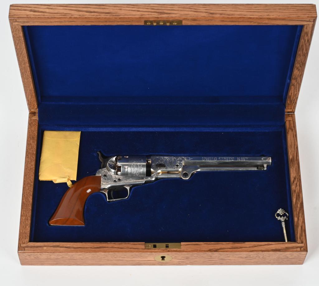 ENGRAVED SILVER PLATED COLT 1851 NAVY REVOLVER: SERIAL 22510. BARREL 7.5". CALIBER .36. Colt black powder series gun that was engraved and silver plated. Hand engraved and attributed to David Perdue. The American Historical Foundation produced thes