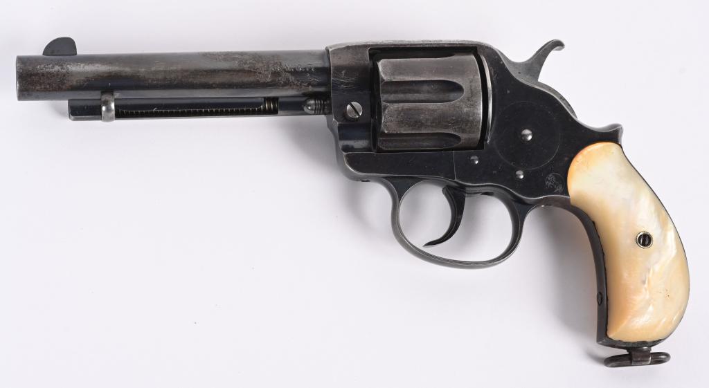 COLT MODEL 1878 DOUBLE ACTION REVOLVER: SERIAL 39927. BARREL 5.5". CALIBER .38 WCF. MADE IN 1898. Antique range, standard revolver with blue finish, bird head MOP grips, lanyard ring. Condition. Overall, at least 75% factory bright blue but