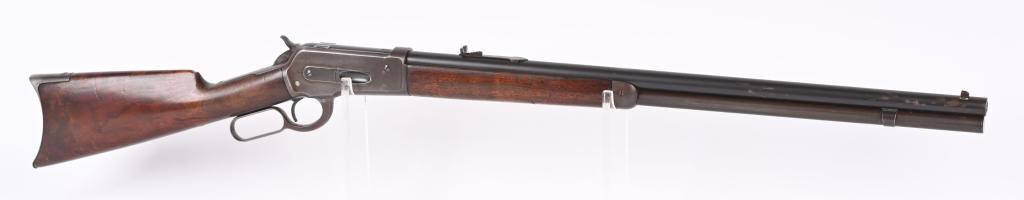 WINCHESTER MODEL 1886 RIFLE: SERIAL 57596. BARREL 26". CALIBER 45-70. MADE IN 1891. Features full round barrel & magazine, flat top rear sporting sight, walnut stocks with rifle butt. Condition. Barrel retains 90% blue with sharp