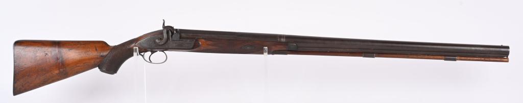 THOMAS WOOLFIELD LONDON 7 BORE MARKET GUN: PERCUSSION. 33" OCTAGON TO ROUND BARREL. 7 BORE OR .875. Quality market gun features walnut half stock, checkered with pistol grip and cap. Smooth steel butt plate. Lock is maker marked and engraved a