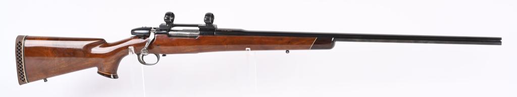 CUSTOM FN SPORTER .375 EPSTEIN BOLT ACTION RIFLE: SERIAL: 2733C BARREL: 28.2" CALIBER: .375 Epstein. Customized rifle built by "G M C ROCKER" as signed on the left side of the barrel. Features Jeweled bolt and magazine follower, Jaeger trigger, porte