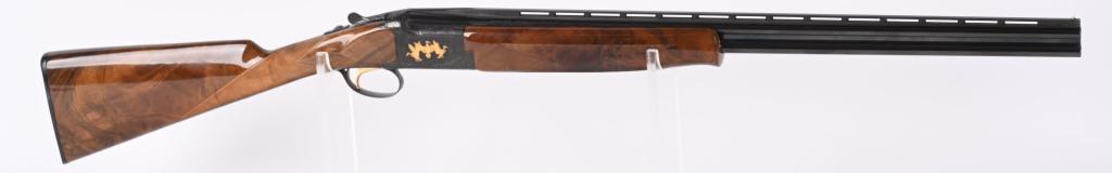 BROWNING GRADE 6 CITORI 410 OVER UNDER SHOTGUN: SERIAL NUMBER 25085NMF83 BARREL 26" CALIBER 410 GAUGE MANUFACTURED JAPAN Elegant Game scene engraved and gold inlaid Over under with vignette of 2 breaking pheasants surrounded by tight scroll and vin