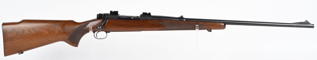 PRE 64 WINCHESTER MODEL 70 BOLT ACTION RIFLE: SERIAL 221026. BARREL 24". CALIBER 30-06. MADE IN 1952. Bolt has matching etched serial number. Standard features include fold down rear sight and barrel collar, ramp front sight, matte blue finish on