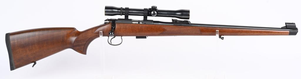 CZ USA MODEL 452-2E FULL STOCK BOLT ACTION 22: SERIAL A773378. BARREL 20.5". CALIBER .22 LR. Metal is blue finish. Rear sight is target adjustable. Ramp front sight with hood. Magazine fed (one included). Rifle sports a Weaver K4 scope, rings moun