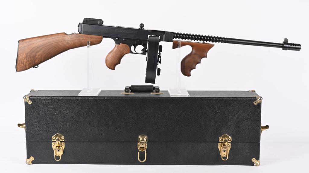 CASED THOMPSON MODEL 1927 A1 SEMI AUTO RIFLE: SERIAL KH5761. BARREL 18". CALIBER .45 ACP. Classic roaring twenties style Chicago Typewriter that features matte finish, compensator, finned barrel, pistol grip walnut fore-arm, pistol grip rear with
