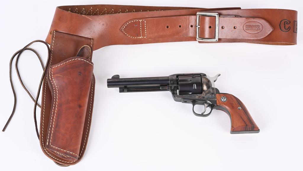 RUGER VAQUERO .45 REVOLVER WITH CUSTOM HOLSTER: SERIAL: 55-11594 BARREL: 7" CALIBER: .45 COLT. Features smooth wood grips with Ruger medallion, case hardened frame, Single Action firing, blued finish, and has the initials "CEB" engraved into the bu