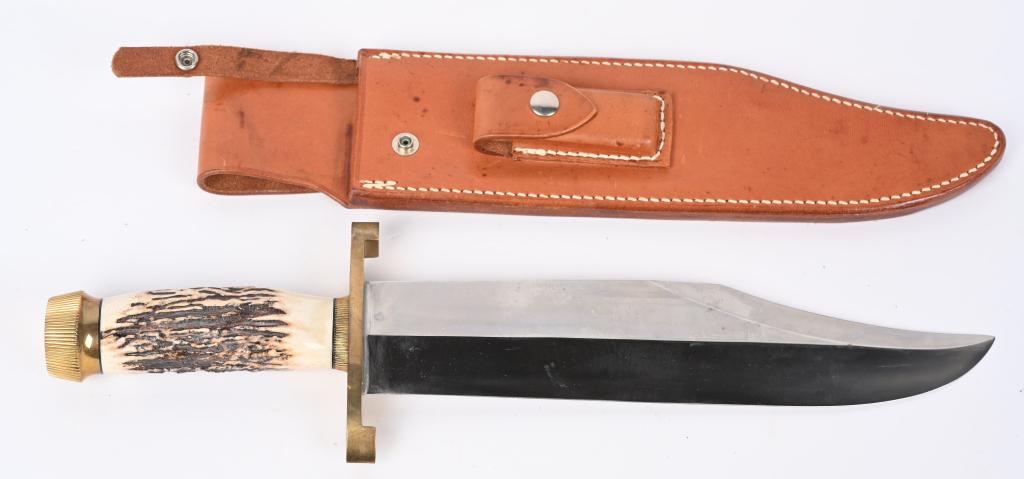 RANDALL MODEL 12 SMITHSONIAN BOWIE KNIFE: Massive 11" carbon steel steel blade with brass double lugged guard. Indian stag handle with scalloped brass collar scalloped brass butt cap. Blade marked "RANDALL MADE ORLANDO,FLA" on left side. John
