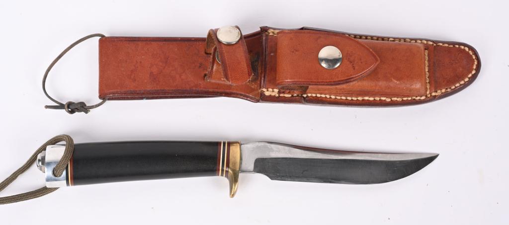 SPL, ORDER MODEL 7 FISHERMAN HUNTER RANDALL KNIFE: 4" carbon steel blade with Brass guard, red, white & black spacers and smooth black Micarta handle with duralumin butt with wrist thing. Johnson rough back scabbard with blank nickel snaps and white s