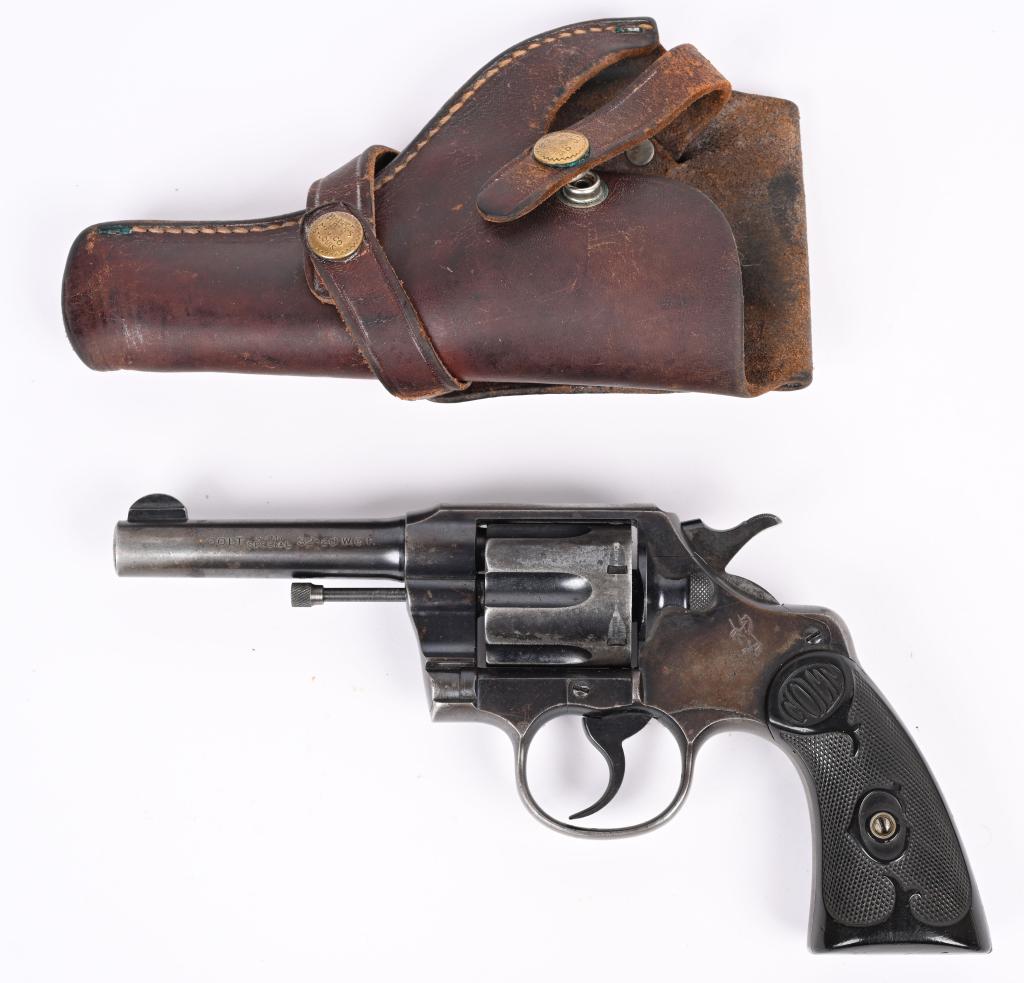 COLT ARMY SPECIAL 32-20 WCF REVOLVER: SERIAL NUMBER 466084 BARREL 4" CALIBER 32-20 WINCHESTER MANUFACTURED 1910. Blue finished with 6 shot swing out cylinder. Single and double action with checkered Colt monogrammed hard rubber grips. Wit