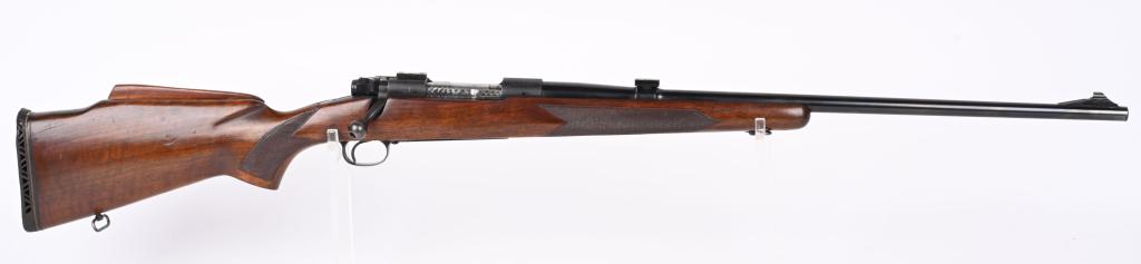 PRE 64 WINCHESTER MODEL 70 BOLT ACTION RIFLE: SERIAL 458607. BARREL 24". CALIBER .243. MADE IN 1959.. No visible etched serial number on bolt that was jeweled. Standard features include ramp front sight, blue finish, rear sight slot has scope blo