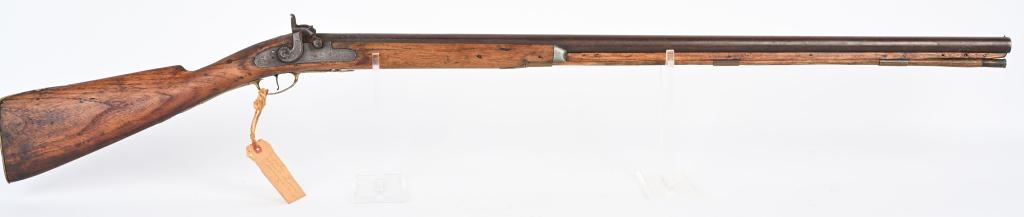 ANTIQUE PERCUSSION HALF STOCK SHOTGUN: NSN. BARREL 36 1/2", CALIBER 12 Gauge. Features Golcher percussion lock, brass hardware, pewter nose cap and wood barrel rib. CONDITION Strong working action with dark bore. Metal has dark patina with