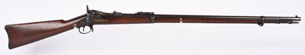 US MODEL 1884 TRAPDOOR SPRINGFIELD RIFLE: SN 530932. BARREL 32 5/8". CALIBER 45-70. It features two barrel bands, nose cap, ram rod bayonet, and Buffington rear sight. Lock is marked US SPRINGFIELD with Eagle in center. Breech block is marked