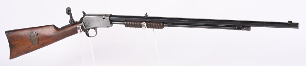 WINCHESTER MODEL 1890 PUMP ACTION 22 RIFLE: SERIAL 681445. BARREL 24". CALIBER 22 LONG RIFLE. MADE IN 1925. Scarce in this caliber. Features full octagon barrel 2/3 magazine, folding leaf rear sight, blue finish, tang sight, walnut stock with r