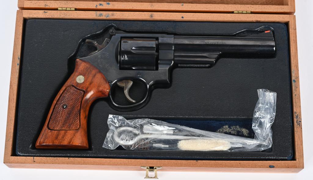 SMITH & WESSON MODEL 25-5 .45 COLT CASED REVOLVER: SERIAL NUMBER N736177 BARREL 6" CALIBER .45 COLT MANUFACTURED 1980. Produced with pinned barrel , blue finish , target stocks target trigger and hammer with red ramp front sight and white outline rear