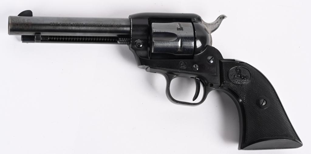 COLT SINGLE ACTION ACTION FRONTIER SCOUT 22: SERIAL NUMBER 65782F BARREL 4 3/4" CALIBER 22 LONG RIFLE MANUFACTURED 1959. Blue finished steel barrel and cylinder with black epoxy finished frame and fitted with checkered hard rubber grips with Ram