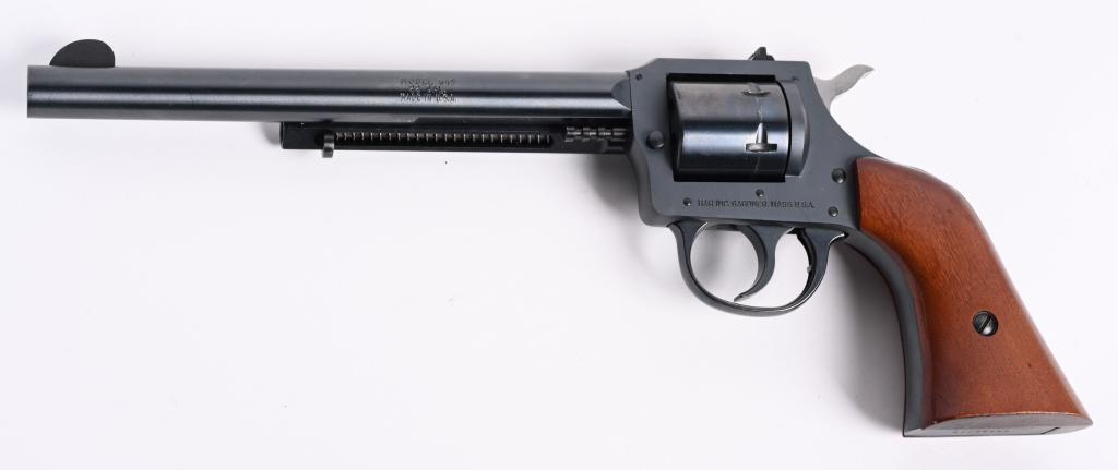 H & R MODEL 649 DOUBLE ACTION .22 REVOLVER: SERIAL AX076625. BARREL 7.5". CALIBER .22 LR. Features six shot, double action, blue finish, wind drift rear sight, 1-piece hardwood grips. Condition. ID number etched in butt. Aside from some light h