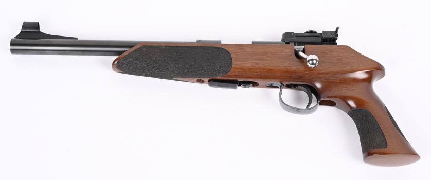 ANSCHUTZ-EXEMPLAR LH BOLT ACTION 22 PISTOL: SERIAL 1323294P. BARREL 10". CALIBER .22 LR. Magazine fed ( 5 shot included), LH bolt, Anschutz target rear sight, Hooded ramp front sight, heavy high polish blue barrel, adjustable trigger, polished 
