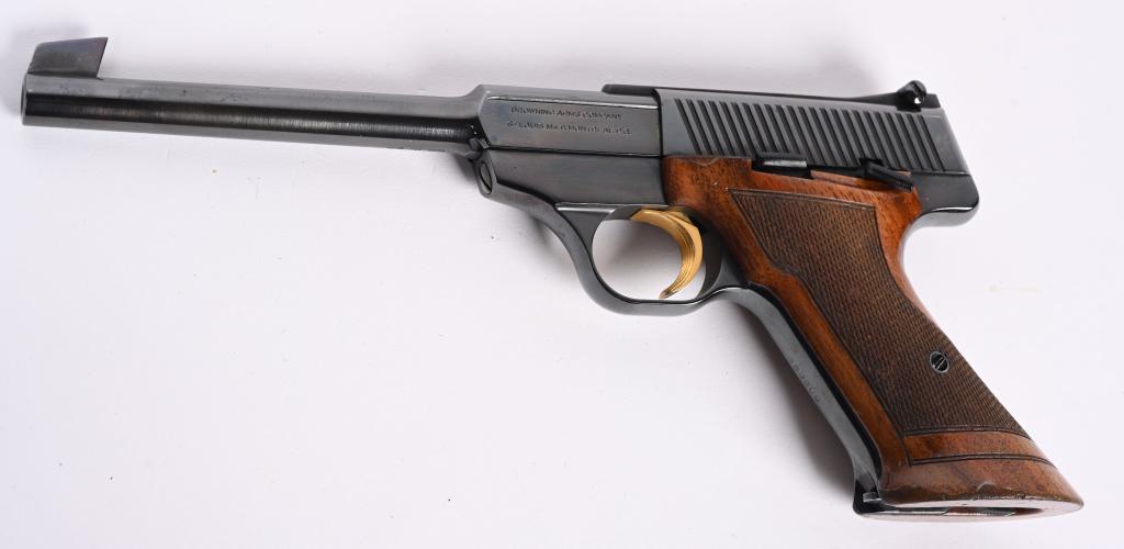 BELGIUM BROWNING CHALLERNGER SEMI AUTO 22 PISTOL: SERIAL 6536U2. BARREL 6 3/4". CALIBER .22 LR. MADE IN 1962. Classic high polish blue finish, gold trigger, adjustable rear sight, large checkered target walnut stocks, one original magazine. Condition