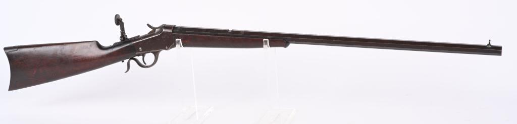 WINCHESTER MODEL 1885 LOW WALL: SERIAL 96931. BARREL 28". CALIBER 25-20 SINGLE SHOT . MADE IN 1909. Full octagon number 1 barrel, rear sight missing, four milled holes for scope base on the barrel , tang sight,, Beech front sight, w