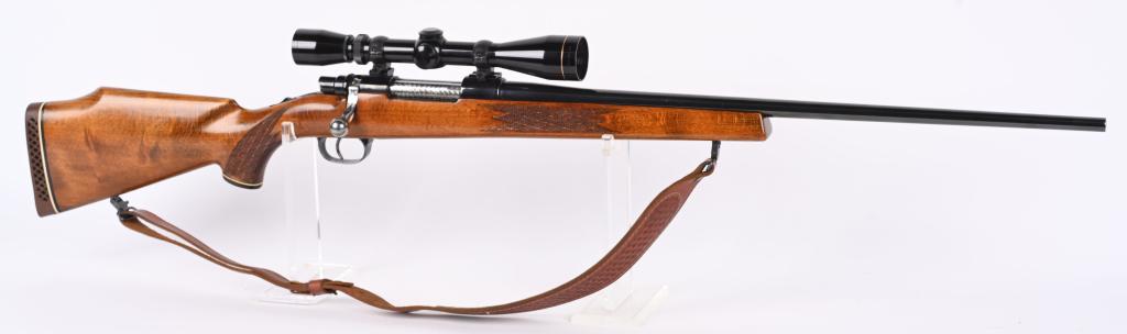 MAUSER BOLT ACTION SPORTING RIFLE: SERIAL P-46856. BARREL 24". CALIBER 30-06. No visible maker but may be Sako or Herters. High polish blue finish, jeweled bolt and release, no barrel sights, engraved floor plate. diamond skip checkere