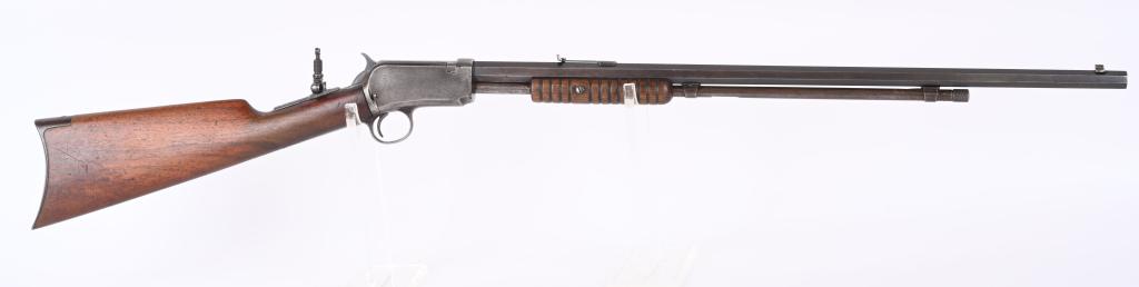 WINCHESTER MODEL 1890 PUMP ACTION 22 RIFLE: SERIAL 482541. BARREL 24". CALIBER 22 SHORT. MADE IN 1912. Octagon barrel, 2/3 magazine, flat top rear sight, tang sight, walnut stock with rifle butt plate and grooved fore-arm. Barrel has P in circl