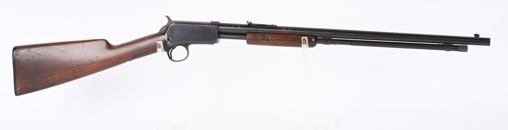 WINCHESTER MODEL 1906 SLIDE ACTION 22 RIFLE: SERIAL 194066. BARREL 20". CALIBER 22 RF. MADE IN 1910. Features a blue finish, take down, nearly full length magazine, flat top rear sight, plain walnut stock with Winchester gutta percha butt plate.
