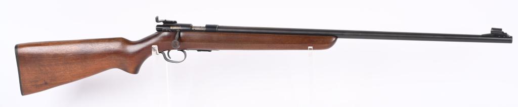 WINCHESTER MODEL 69-A .22 RIFLE: NSN. BARREL 25". CALIBER .22 RIMFIRE. MADE 1935-63. Bolt action, magazine fed (included) blue finish, rear peep sight, hooded ramp front sight, one piece pistol grip plain walnut stock, Winchester bla