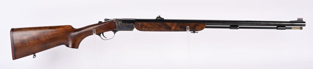 AMARI SPORT BLACK POWDER .50 RIFLE: NSN. BARREL 27 3/4". CALIBER .50. Breech loading black powder rifle. Blued finish on barrel, case colors on receiver with deluxe grain wood. CONDITION Appears unfired and is near new. BLACK POWDER