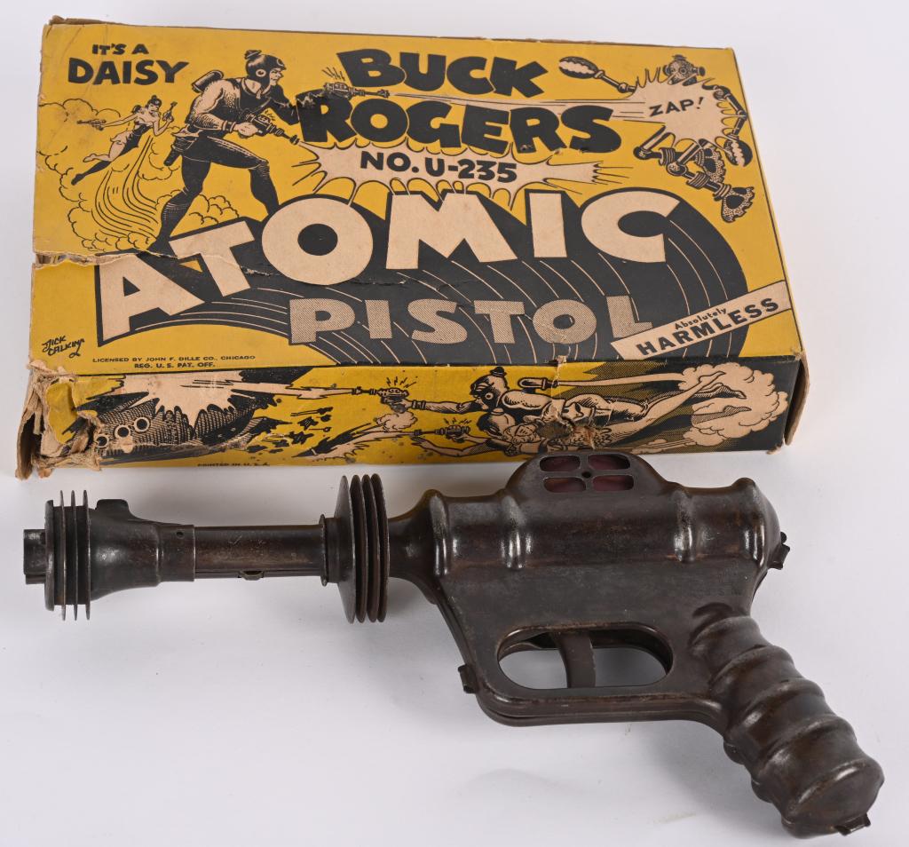 DAISY BUCK ROGERS ATOMIC PISTOL w/ BOX: All original and in great condition. Still works. Comes with Buck Rogers Adventure Book and Box. 10" Excellent