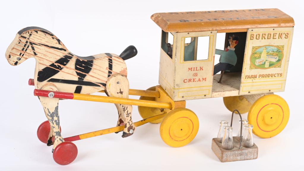 RICH TOYS BORDEN'S MILK WAGON: All original tin and wood Horse Drawn Borden's Milk Wagon. Comes with a driver and milk carton with bottles. Has some wear. 20" Very Good