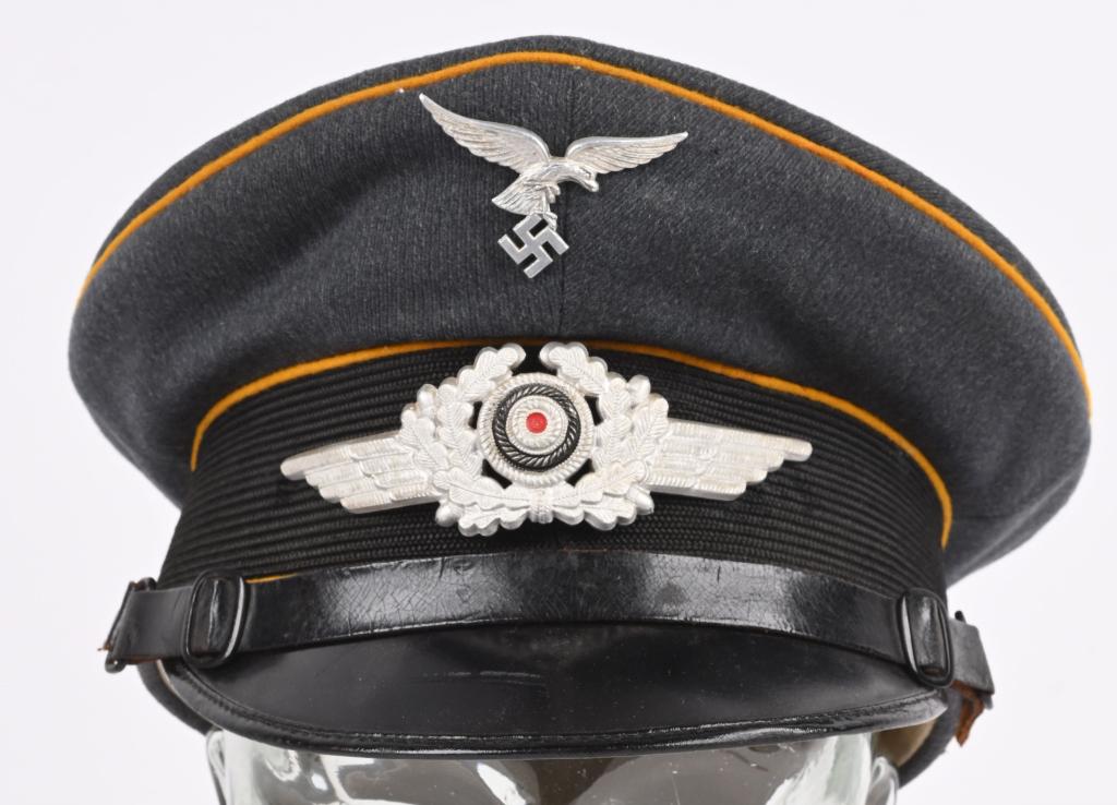WWII NAZI GERMAN LUFTWAFFE FLIGHT VISOR HAT WW2: Nice quality, issued, Luftwaffe blue/gray, wool/tricot blend construction visor cap, features a black, horizontally ribbed, interwoven, mohair centerband, and golden yellow wool waffenfarbe piping to