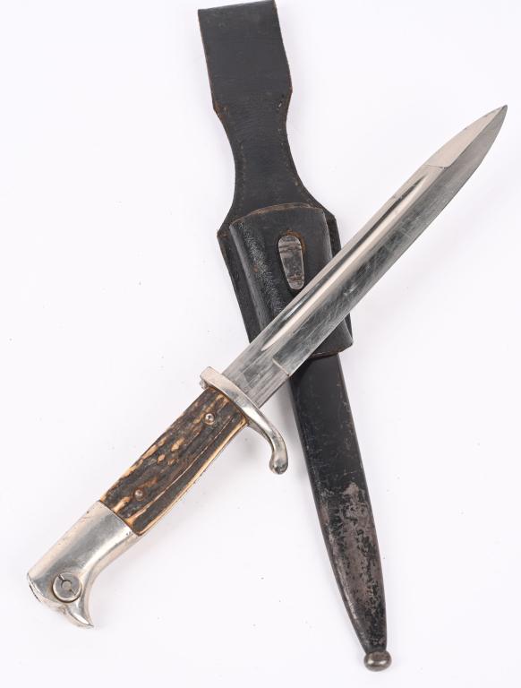 WWII NAZI GERMAN EM'S STAG HANDLE DRESS BAYONET: Roughly 24cm long nickel/silver plated drop forged steel construction blade with wide fullers to each side. Maker marked to Paul Selheir. The bayonet has a nickel/silver plated alloy opened muzzle rin