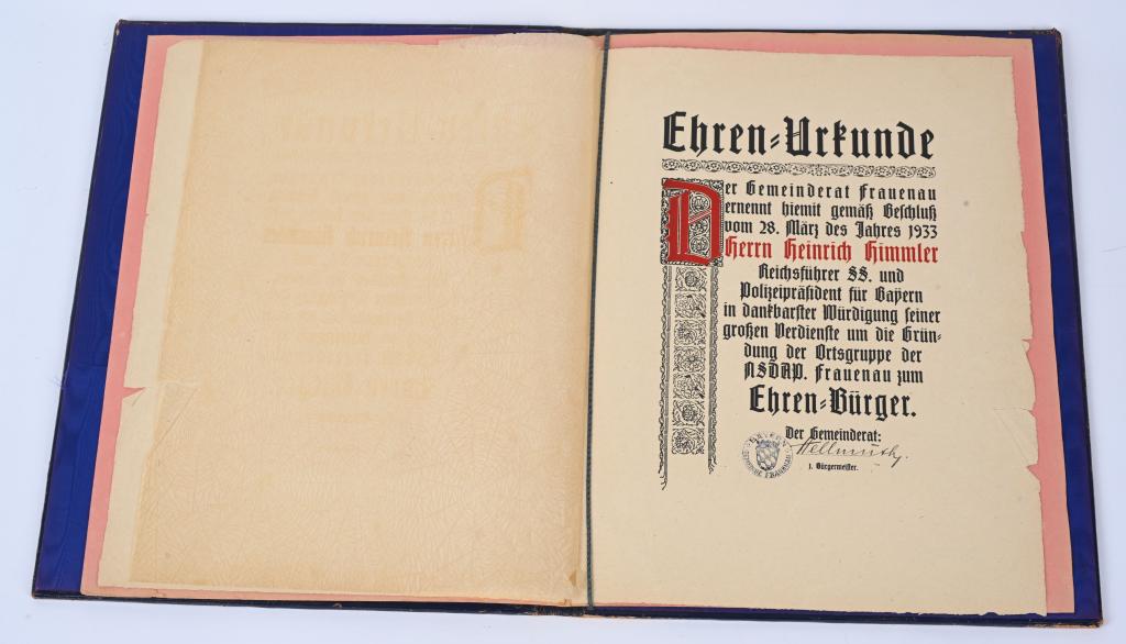 WWII NAZI GERMAN HEINRICH HIMMLER DOCUMENT SIGNED: Heinrich Himmler - A Honorary Citizen Certificate, Hand made paper folio with black and red print from the town council of Frauenau on 28 March 1933 with thankful appreciation of his great merits in c