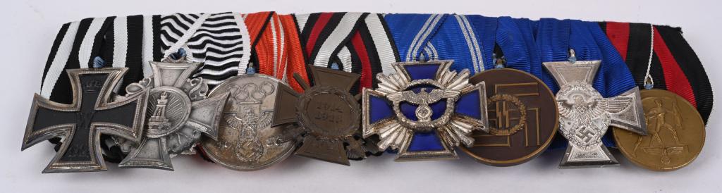 WWII NAZI GERMAN SS 8 YEAR NSDAP 15 YEAR MEDAL BAR: Unbelievably stunning WWII Nazi German 8 place medal bar to include 1) IRON CROSS 2ND CLASS 2) DRKB MEMBERSHIP MEDAL 3) 1936 OLYMPIC GAMES COMMEMORATIVE MEDAL 4) COMBATANTS CROSS OF HONOR 1914/18 5) N