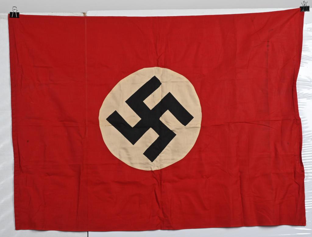WWII NAZI GERMAN NATIONAL PARTY FLAG W WEIGHTS WW2: Multi-piece cotton construction banner approximately 31 x 42 inches and is weighted to the bottom so it hangs properly. To one side a red field with a sewn white disk with a printed mobile swastika in