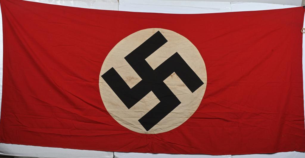 WWII NAZI GERMAN NSDAP FLAG DOUBLE SIDED WW2: Multi-piece cotton construction banner approximately 46 x 90 inches. To both its red fields are sewn are white disks, with printed mobile swastikas in black. Shows the expected light period use and we