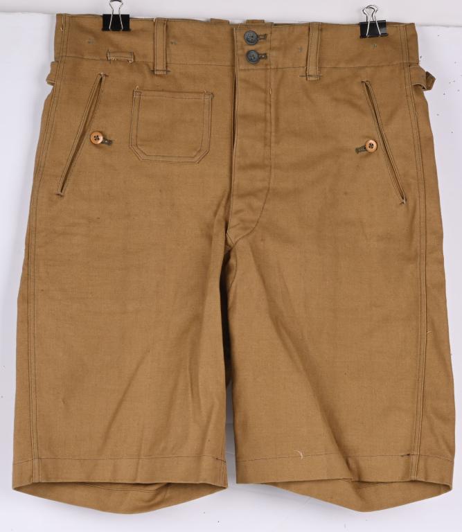 WWII NAZI GERMAN WAFFEN SS TROPICAL SHORTS WW2: (Tropen Kurze Hose) Light weight, ribbed, tan cotton twill construction short pants feature a vertical, four button French fly with an additional two buttons positioned on the waistband. Six inverted 