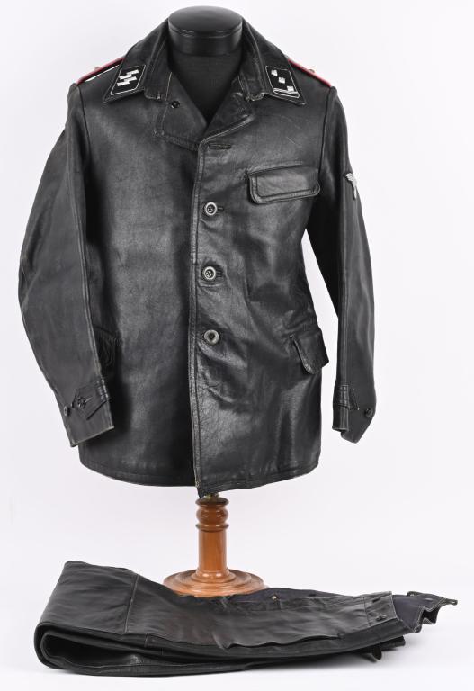 WWII WAFFEN SS PANZER LEATHER OFFICER'S UNIFORM: Three-quarter length, multi-panel, blackened leather construction jacket features a vertical, five button, front closure with a single metal hook and eye positioned at the forward neckline and a laydo