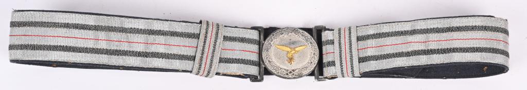 WWII NAZI GERMAN LUFTWAFFE BROCADE OFFICERS BELT: This is a good example of a desirable set. There is some slight wear and discoloration to the brocade. The Tombac buckle is in very good condition. It has a silver finish that remains mostly intact. T