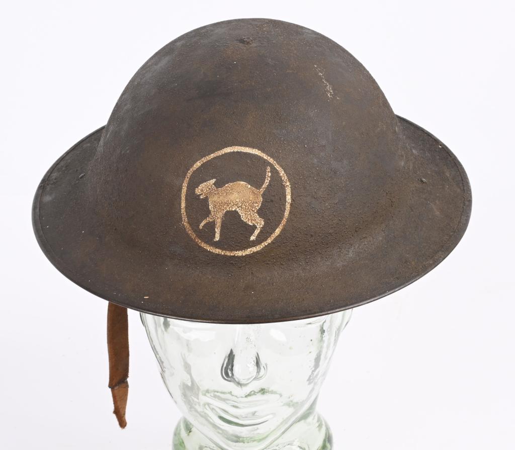 WWI 81ST DIVISION PAINTED US ARMY HELMET WW1: Attractive WWI 81st Division painted helmet with liner and broken chinstrap. The insignia is nicely hand painted to the front in the form of a Wildcat in excellent condition. The lot number on the rim