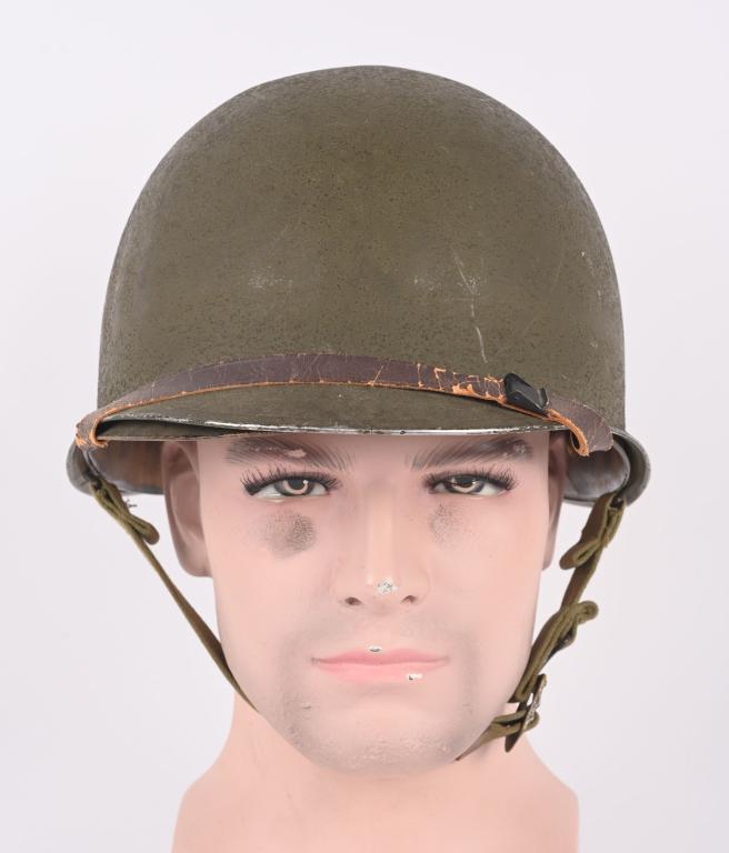 WWII US ARMY M1 M-1 FIXED BAIL HELMET W LINER WW2: WWII US Army Fixed bale front seam magnesium shell. The shell retains almost all of its rough-textured olive drab paint to the exterior with some expected wear to its stainless steel rim. Chinstrap is