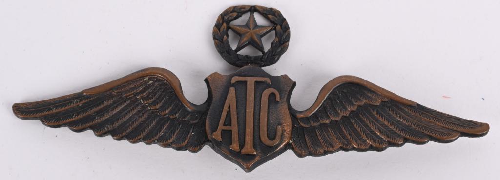 WWII AIR TRANSPORT COMMAND SUPERVISOR PILOT WING: This is a very rare WWII United States Army Civilian Air Transport Command Supervisor Pilot's Wing. Wing shows a crest reading ATC flanked by a pair of spread wings with a wreath with a star to the ce