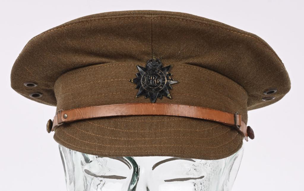 WWI ROYAL VICTORIA RIFLES CANADA ENLISTED VISOR: A khaki wool M1905 visor cap with a Victoria Rifles of Canada cap badge that is attached by a single slider to the front band. A brown leather chinstrap is attached via a pair of brass buttons and can