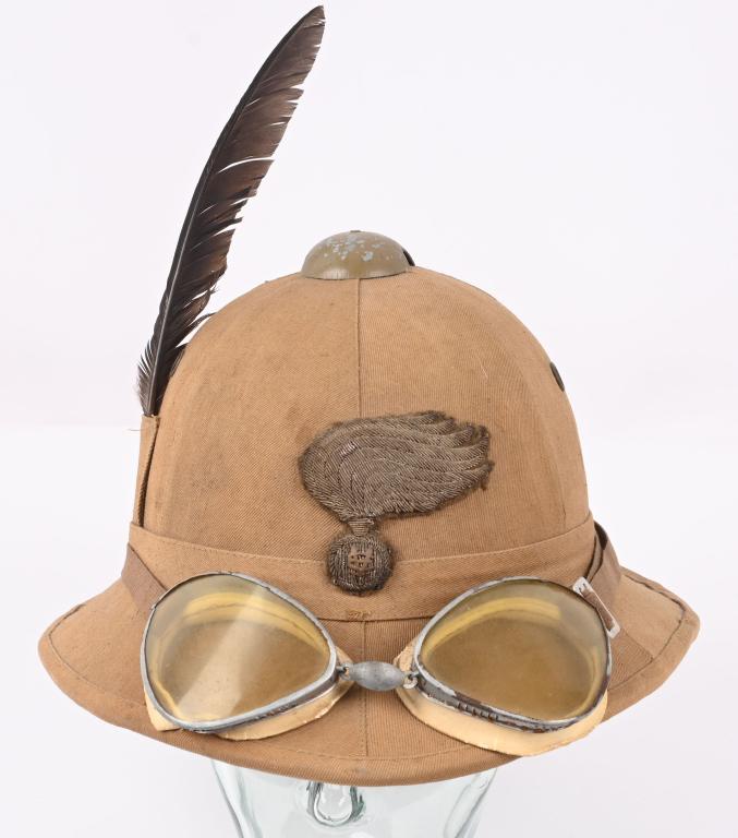 WWII ITALIAN M1935 PITH HELMET WITH GOGGLES WW2: Original era manufacture. A sound example with no damage to the cork body or cloth covering. The chinstrap is missing. Beautiful bullion Carabinieri emblem. Helmet comes with an original set of s