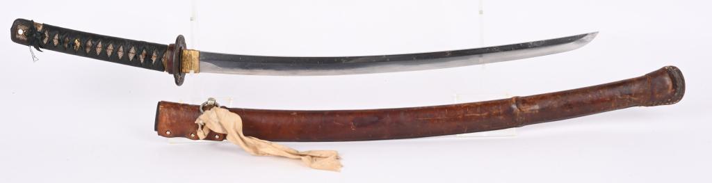 JAPANESE WAKAZASHI and SAYA w/ SIGNED TANG: 21 1/2" cutting edge on bright blade with active hamon. Blade is nice with scattered light pitting and rubs. One hold tang signed on one side Kage Nobu. Nice 2 piece habaki and decorated iron tsuba ad