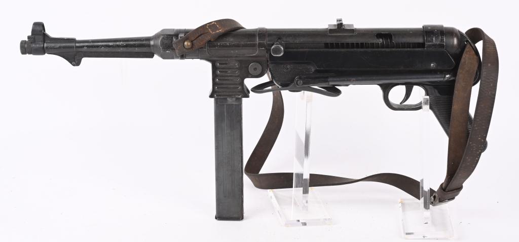 WWII NAZI GERMAN MP 38/40 NON FIRING MACHINE GUN: MP40 Nazi German Sub Machine Gun with Original Leather Sling. Non-Firing Movie Prop Replica. All Controls are Functional and it can be disassembled like the Real Gun. All Metal Construction Furniture.