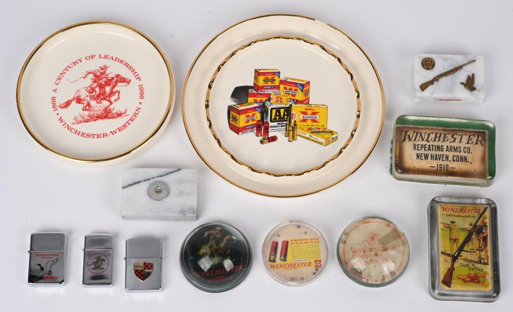 WINCHESTER ASH TRAY SMOKING LOT: Winchester Ashtrays, Lighters & Paperweights- Lot of (2) Ashtrays/Dresser Valet Trays (1) chipped; (3) Winchester marked Zippo Lighters; (6) Paperweights